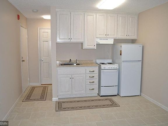 Kitchen with space for a small table. Left side far end of photo is the entry to unit from hallway. A little further to the right is another door you can see, that is the walk-in closet. Just outside of the walk-in closet is a 10-ft hallway that leads to