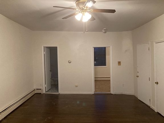 LIVING ROOM SHOWING BEDROOM AND BATH
