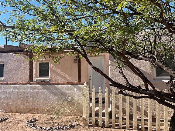 View of patio and guest house entrance from main house yard.