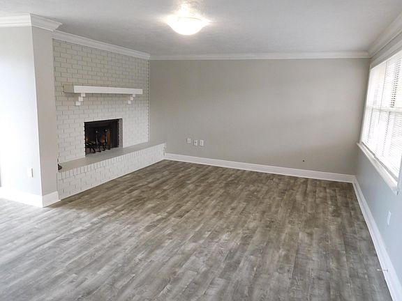 Family room with brick fireplace