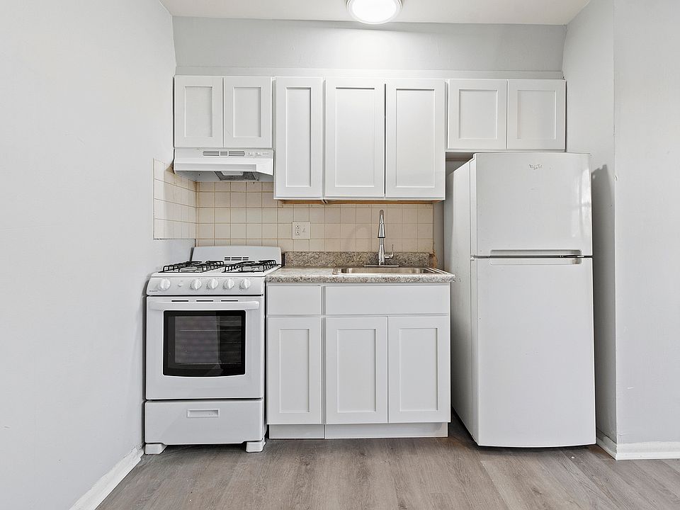 Experience efficient cooking in this sleek, space-saving kitchen.
