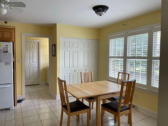 Eat-in kitchen with large pantry leads to laundry room.
