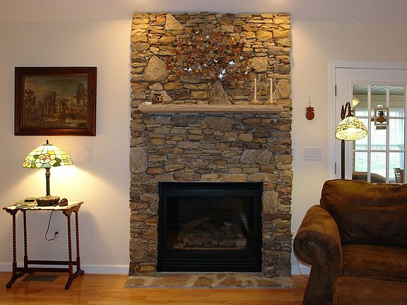 Stone faced gas-log fireplace