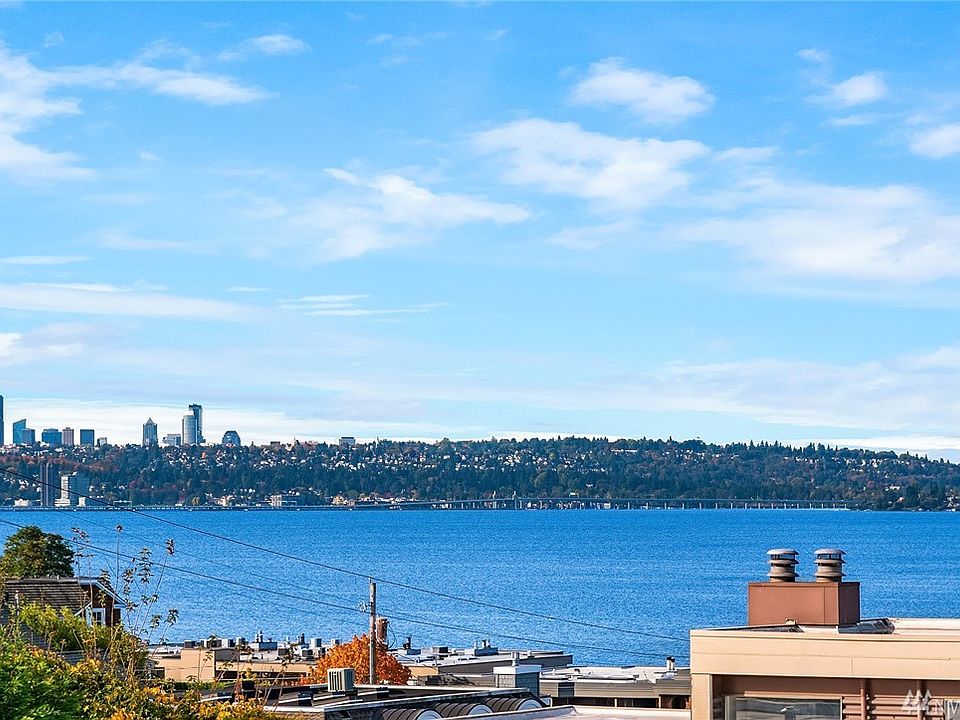 Impressive lake, mountain & City Views from the living room, kitchen & dining room.