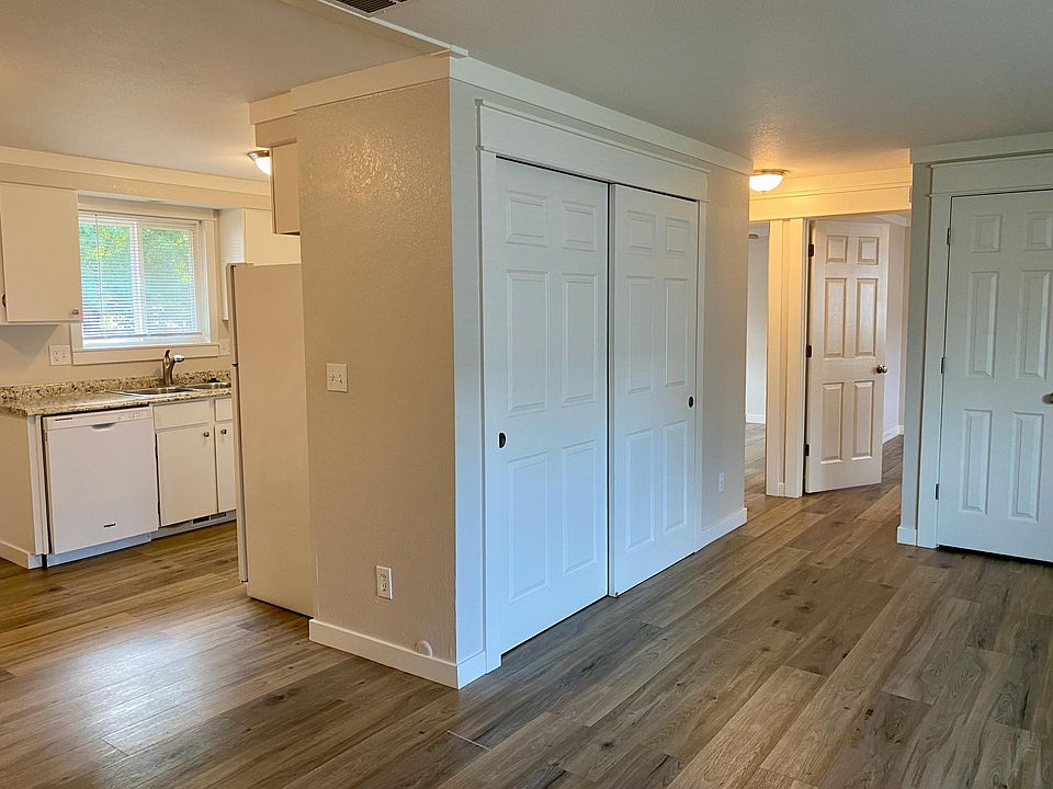 View from family room towards the main closet, entry closet, and bedrooms