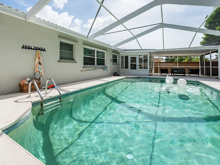 Professionally serviced and cleaned swimming pool.