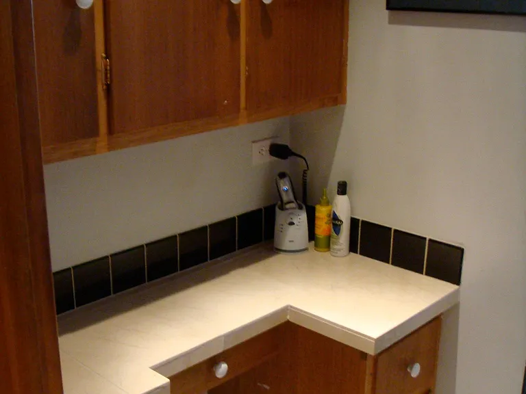 Small Vanity Area and Storage in Main Bathroom