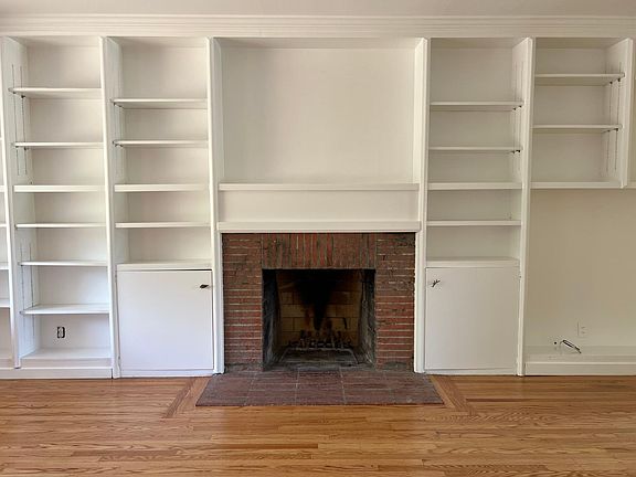 Lots of storage, along with fireplace, in living room!