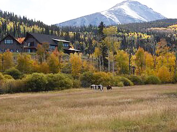 View of the house in the late Fall facing West from the range property below.