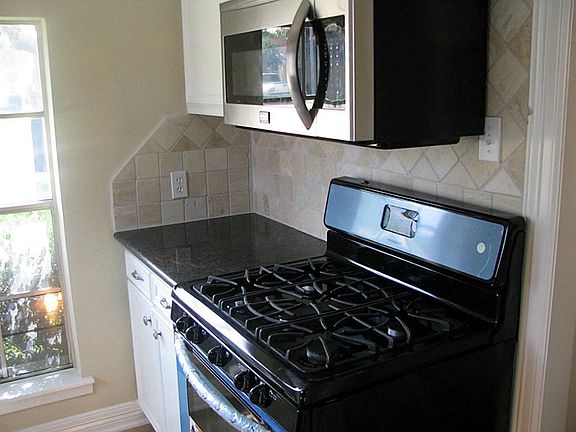 Kitchen with new appliances and Granite Cabinets
