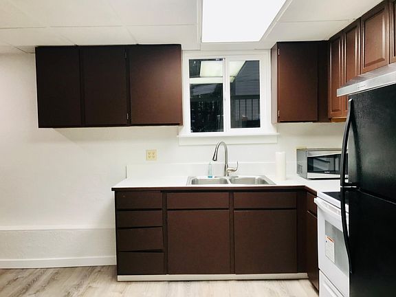 Kitchen - stove, refrigerator, microwave, and range.