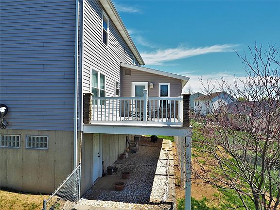 Private composite deck with lighted and brick posts. Also a large great room addition.
