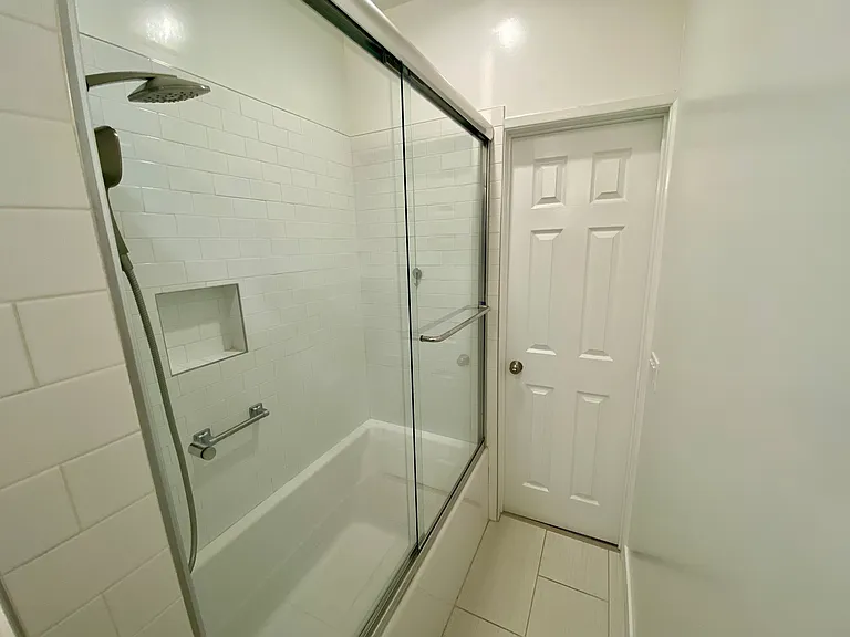 Soaking tub and shower in bathroom 1