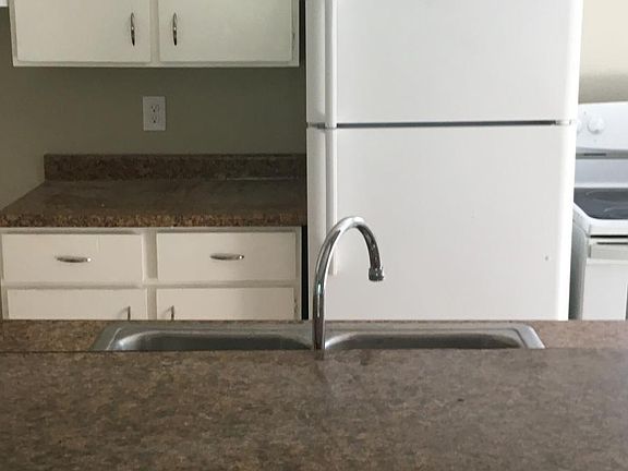 Kitchen open to the living room with bar area