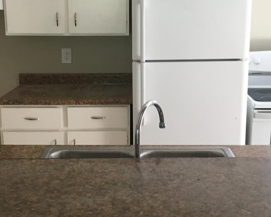 Kitchen open to the living room with bar area