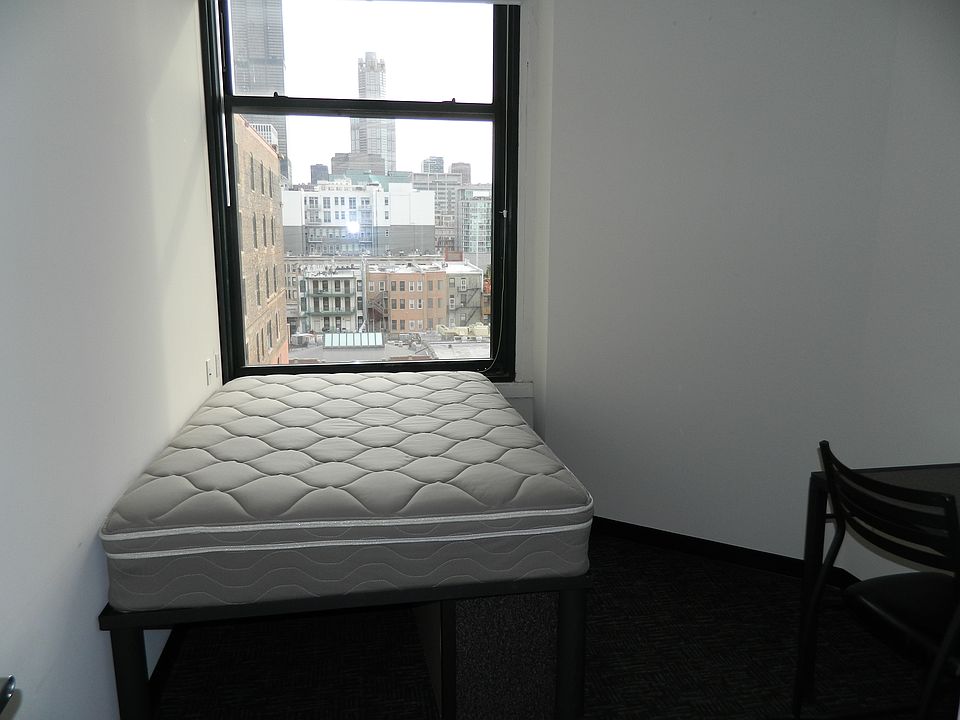 small, furnished, clean bedroom with great view