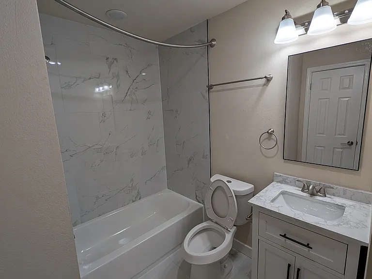 2nd common bath with designer tiles and vanity