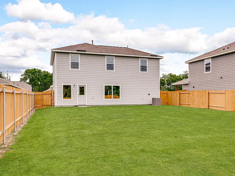 The back yard is fully fenced-in.