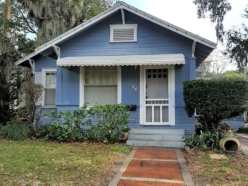 Frontal view of (17 N Hyer). Entrance to dwelling with brick walkway from parking area.