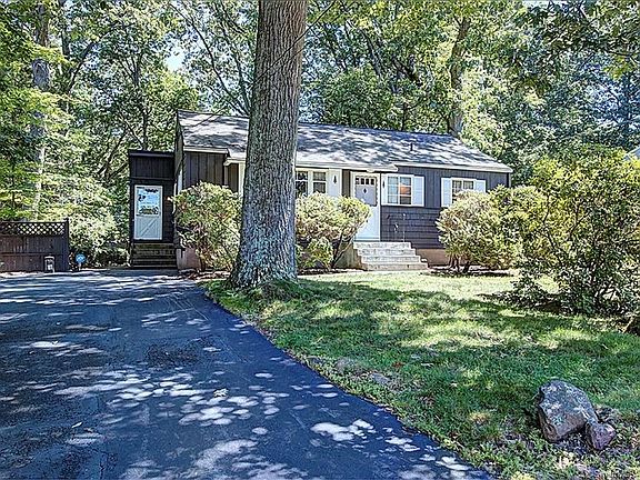 Front exterior picture of 5 Lynwood Place. The roof is 10 years old and the exterior siding was painted 2 years ago. The front steps to the main entrance were resurfaced 2 years ago. Please note that there are 2 front entrances.