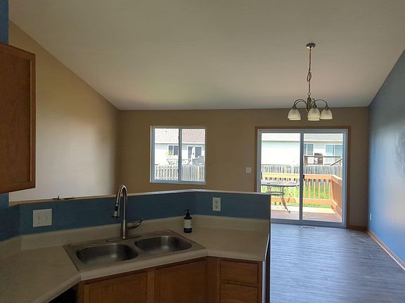 Brand New Contiguous Luxury Plank Flooring throughout Kitchen, Living & Dining Room, and hallways! Cathedral Ceilings.