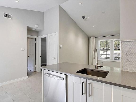 Kitchen to front windows.