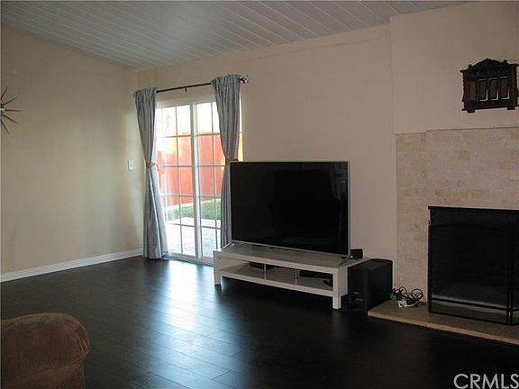Open living room with French doors to the back yard