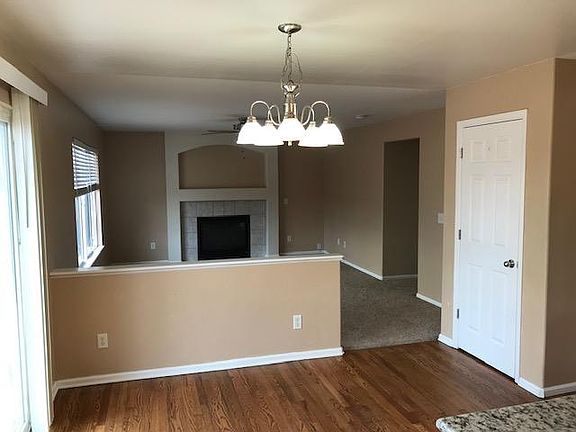 Family room view from kitchen with gas fireplace