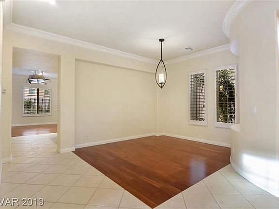 Formal dining room with custom light fixture