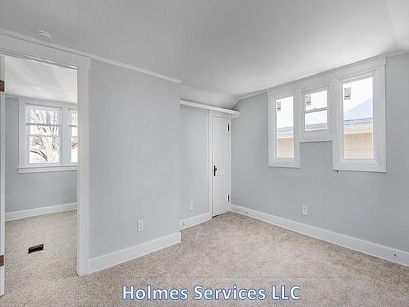 Living room - door on the left is to the bedroom & door on the right is for a walk-in closet (there are two!)