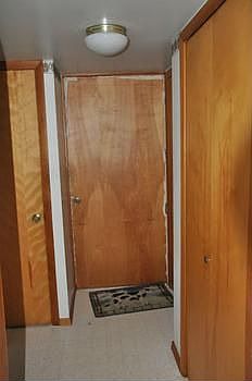 To the rear of the kitchen is the back entry.  The door leads out to the backyard area.  The foyer contains a large storage closet and a linen cloest for the bathroom.