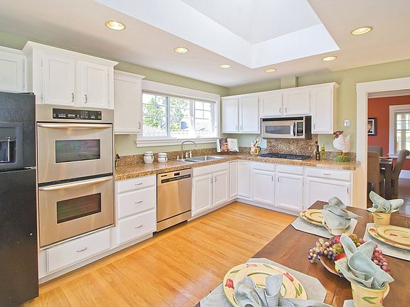 Sunny Eat-in Kitchen opens to deck and yard