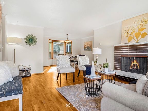 The attractive living room sits just off the entry foyer. The gorgeous, and just refinished, hardwoods extend from the living room and into the dining room, hallway, and all bedrooms.