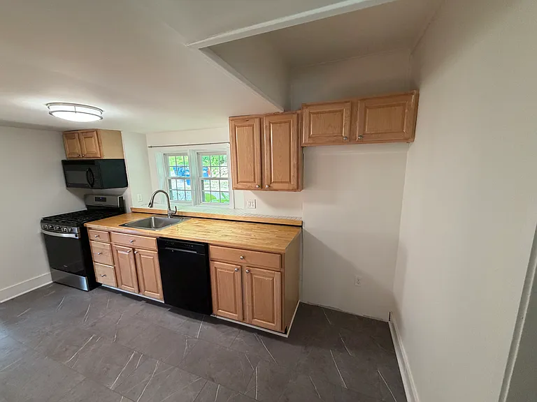 Kitchen - brand-new refrigerator is being installed