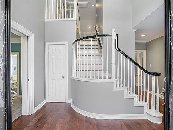 Beautiful double doors open to this spacious foyer.