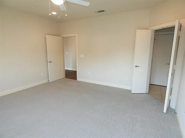 Spacious Master Bedroom with beautiful carpet