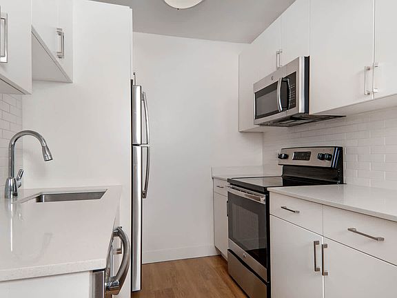 Kitchen with Stainless Steel Appliances and Quartz Countertops