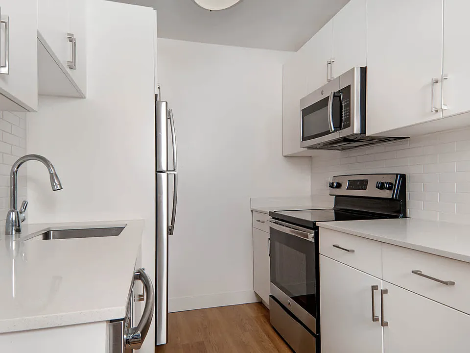 Kitchen with Stainless Steel Appliances and Quartz Countertops