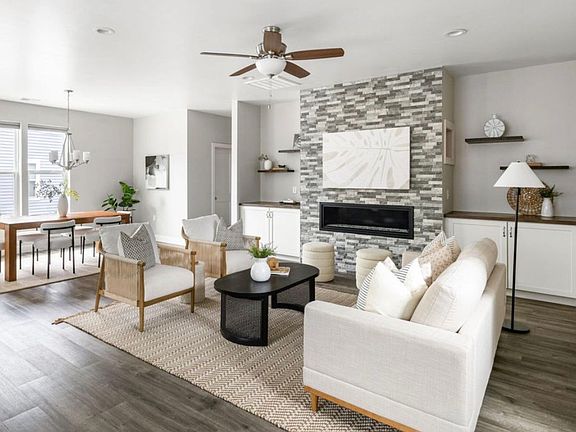 Living room with gas fireplace and custom storage and shelving