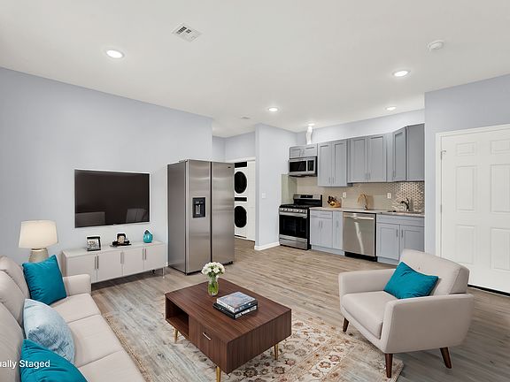 Open Kitchen / Dining / Living- Image is Virtually Staged