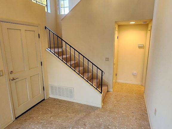 Entry w/ Downstairs Powder Room & Coat Closet