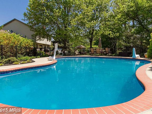 In-ground pool, privately located on acre+ lot
