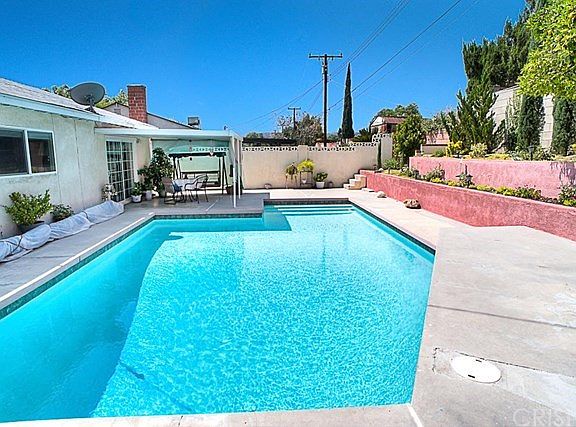 The private backyard with sparkling pool recently