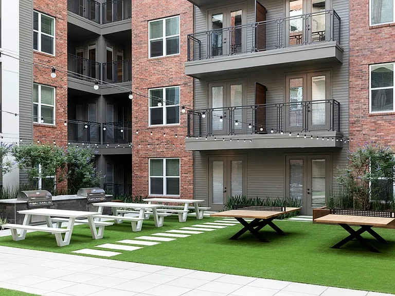 Dine Al Fresco in the Recreation Courtyard with Cornhole + BBQ Grill