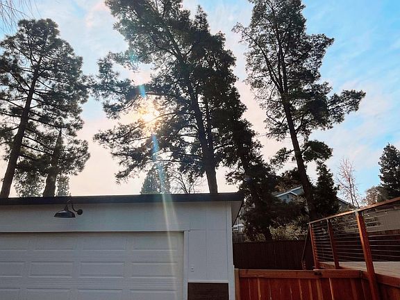Large driveway with large detached 2-car garage