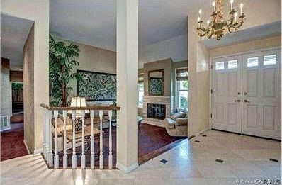 Double Door entry with Formal living with Cozy Stone Fireplace