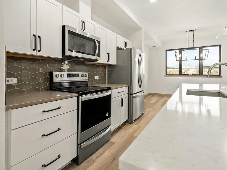 Large kitchen with island (left side view)