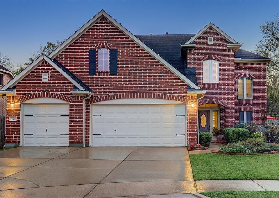 This beautiful Trendmaker home with a screened porch and in-ground pool is filled with stunning decorator features throughout. T