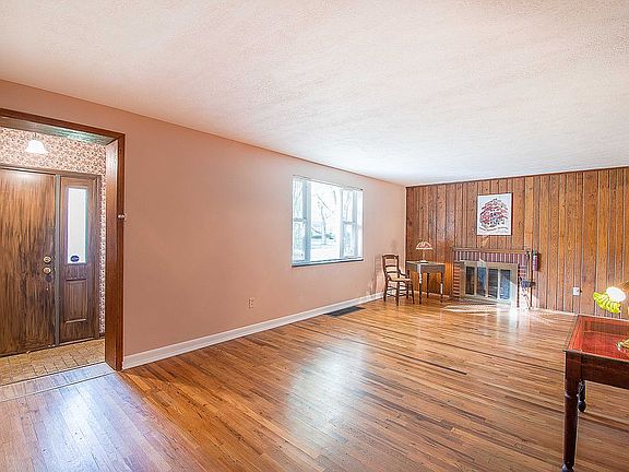 Hardwood floor & fireplace.