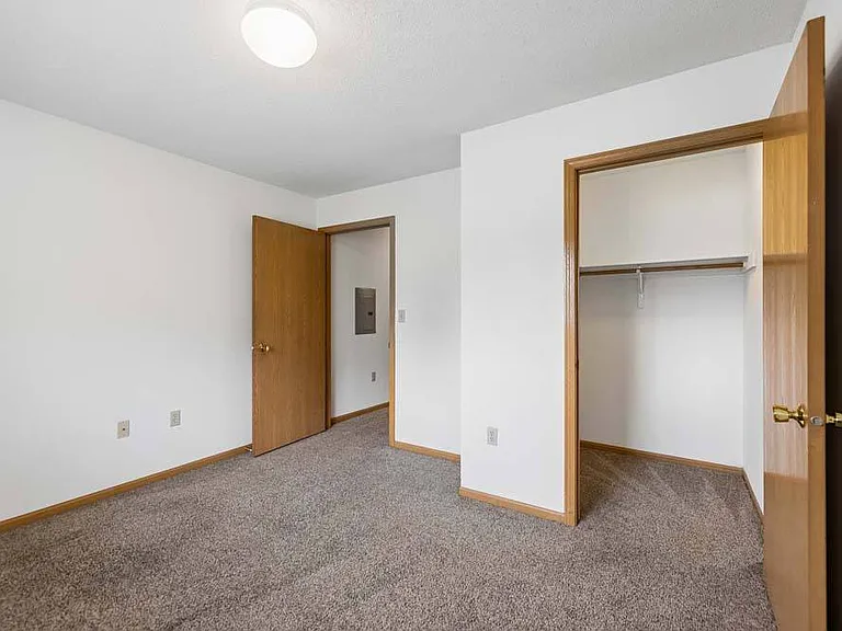 Generous closet space and a bright, comfortable layout make this bedroom a welcoming place to unwind.